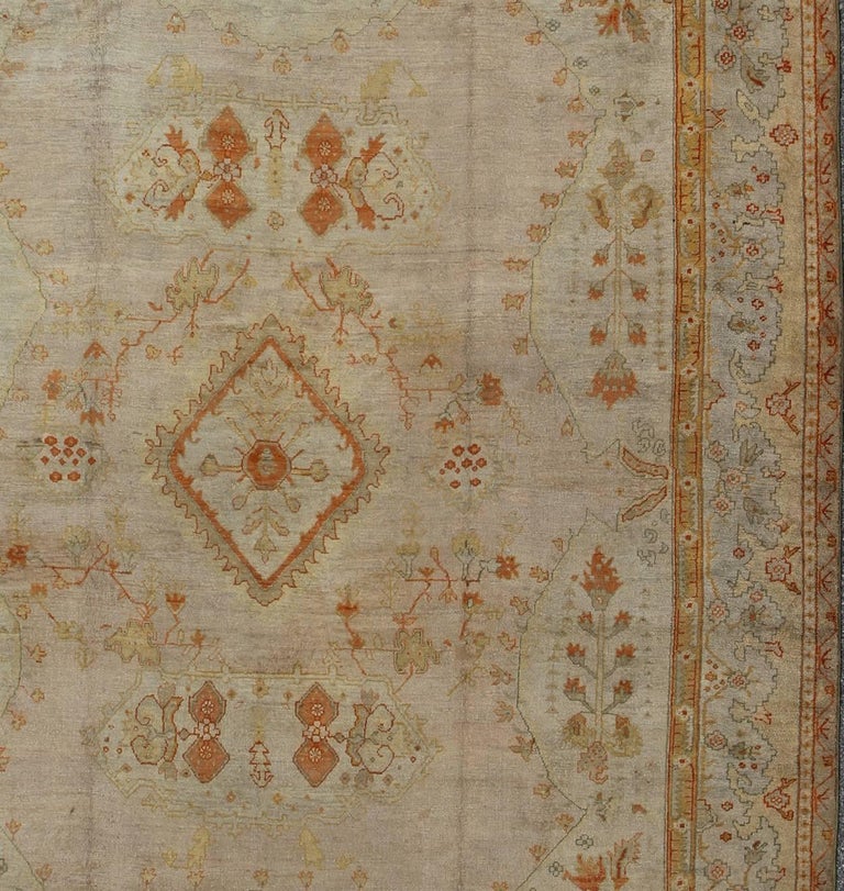 19th Century Antique Turkish Oushak Rug in green, Yellow, blush, apricot and light blue For Sale