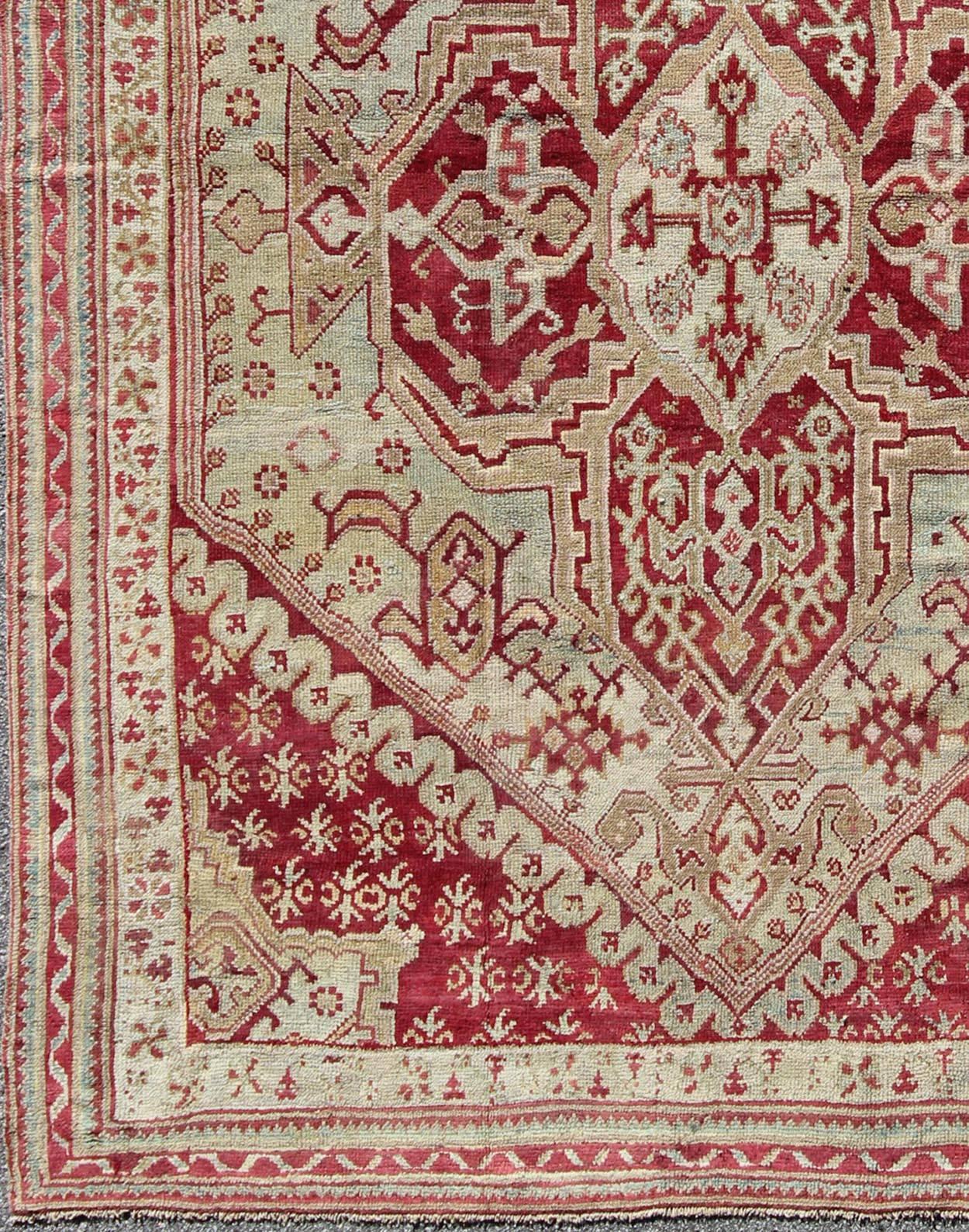  Antique Turkish Ghiordes,  from 19th Century Oushak area in Raspberry Red, Ice Blue & L. Green and geometric medallion, corners and borders                                  

Antique Turkish Ghiordes Rug, Keivan Woven Arts/rug/ D-0904, country of
