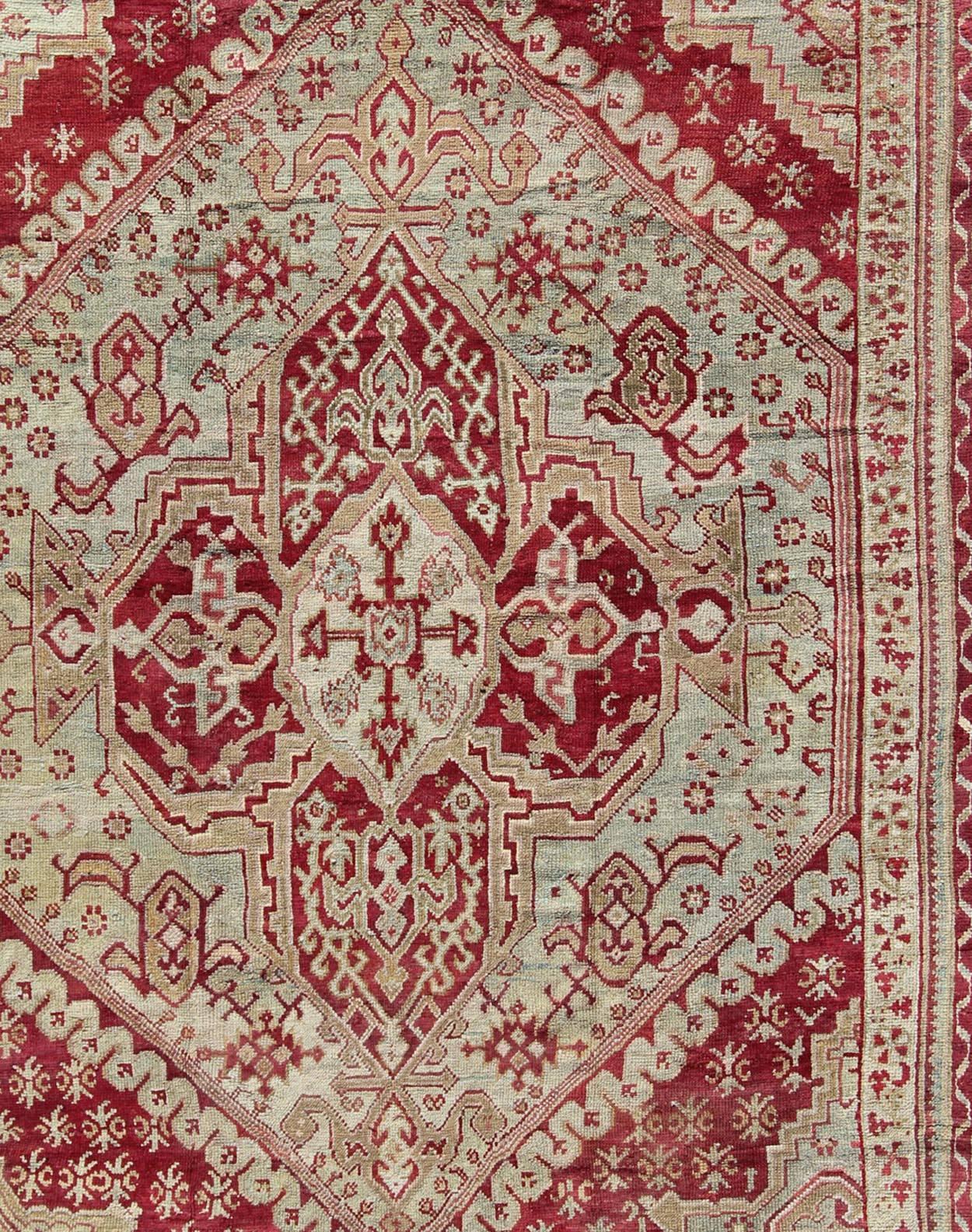 Hand-Knotted Antique Turkish Ghiordes 19th Century Rug in Raspberry Red, Ice Blue & L. Green For Sale