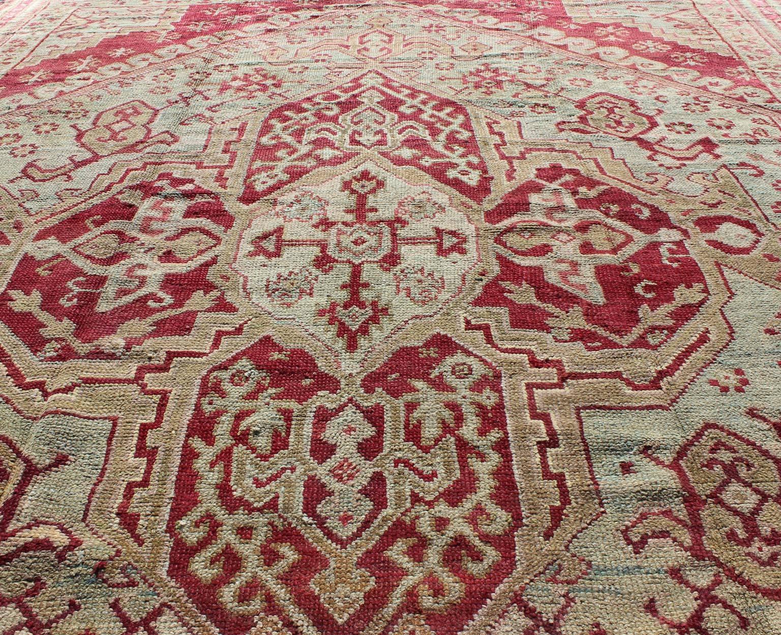 Wool Antique Turkish Ghiordes 19th Century Rug in Raspberry Red, Ice Blue & L. Green For Sale