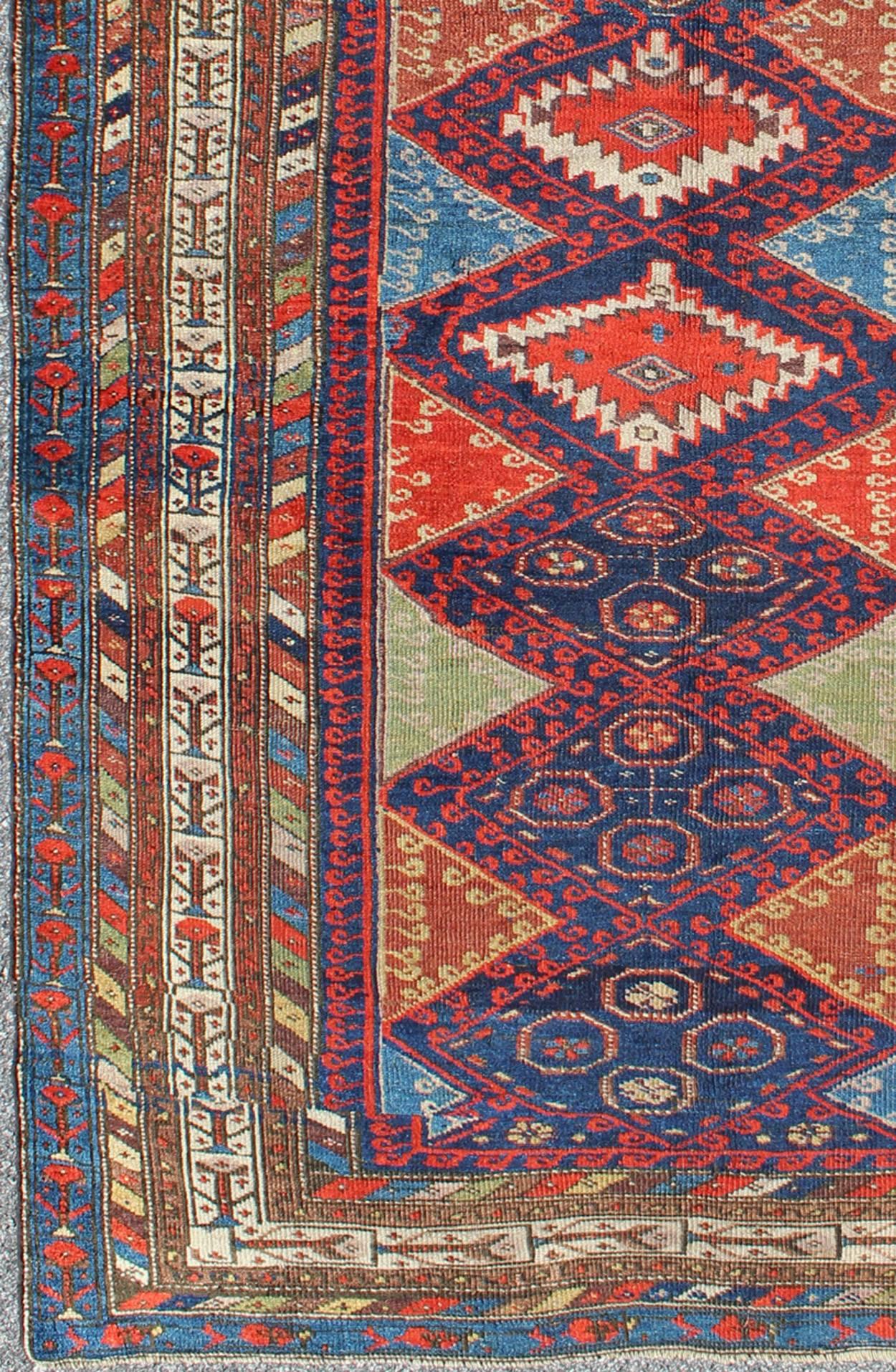 Regardless of where you place this remarkable carpet, its stunning array of colors and exquisite geometric design will transport you to a place of rare, exotic beauty. Fashioned during the late 19th century, this rug displays a repeating diamond
