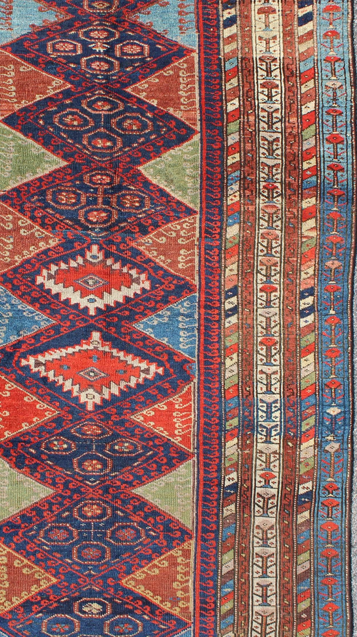 Hand-Knotted Antique Kurdish Kazak with Tribal and Geometric Motifs In Blue, red & Green For Sale
