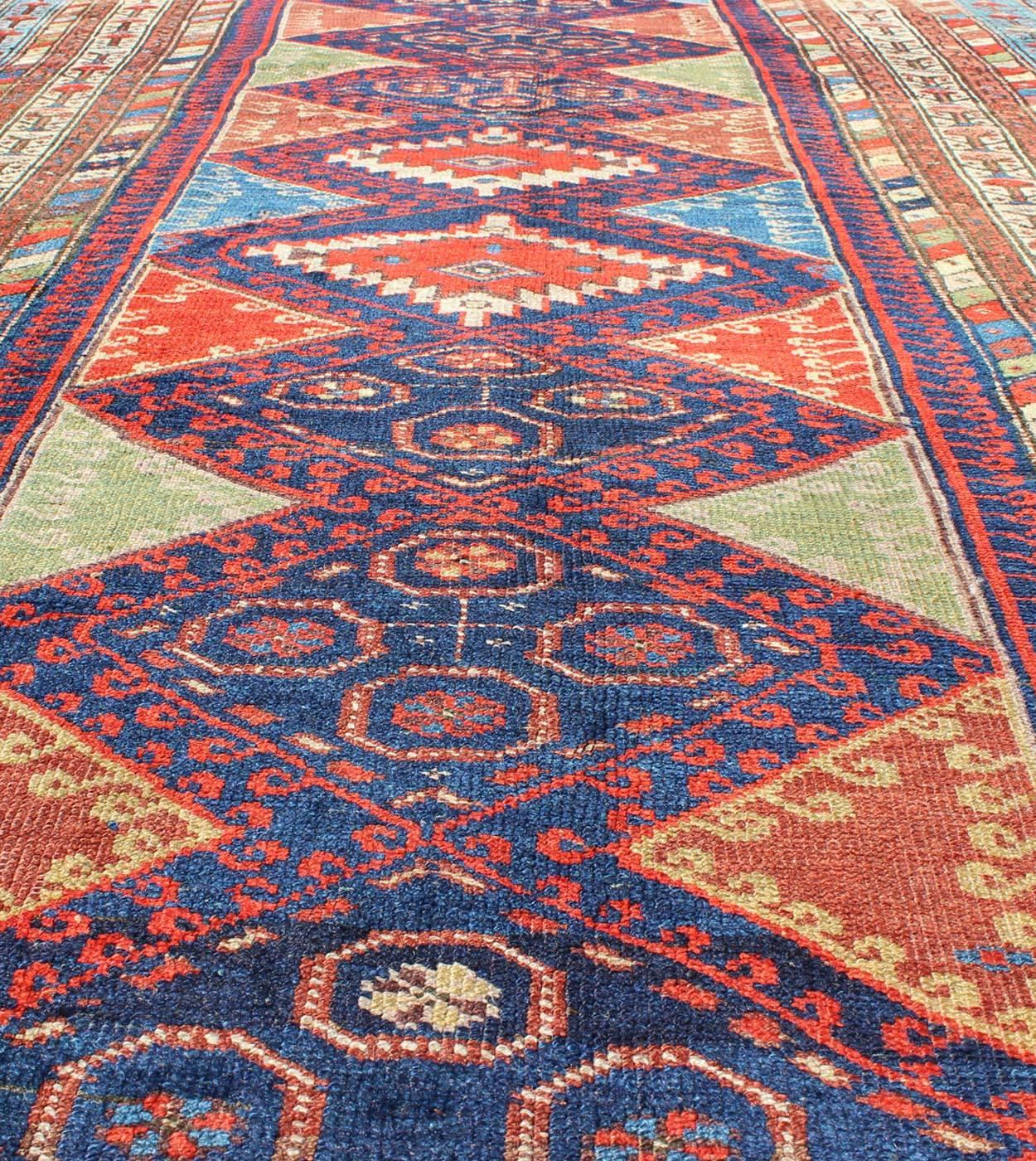 19th Century Antique Kurdish Kazak with Tribal and Geometric Motifs In Blue, red & Green For Sale