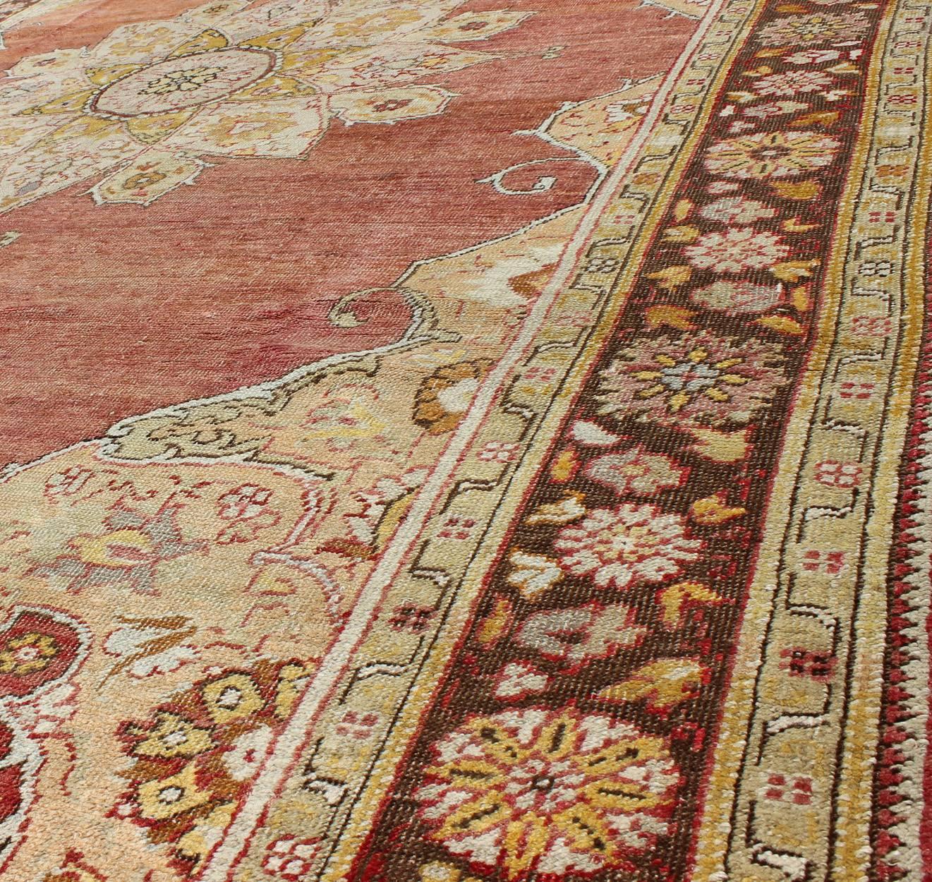 20th Century Antique Oushak Medallion Rug in Rose, Pale Green, Light Blue, Gold and Brown  For Sale