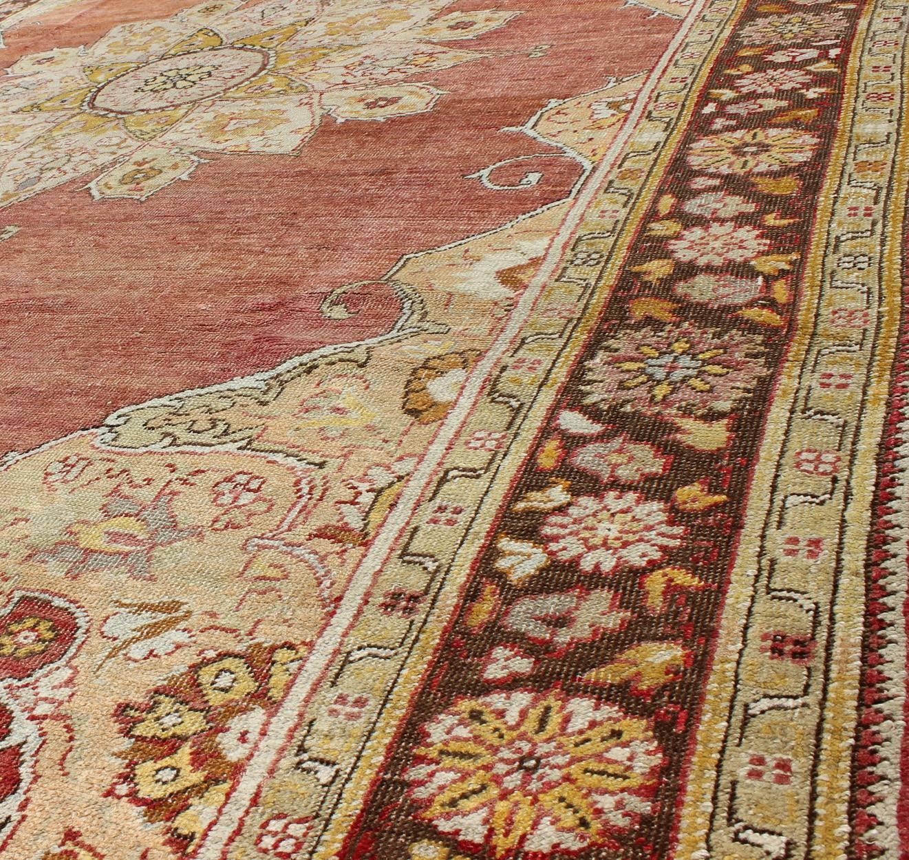 20th Century Antique Oushak Medallion Rug in Rose, Pale Green, Light Blue, Gold and Brown For Sale