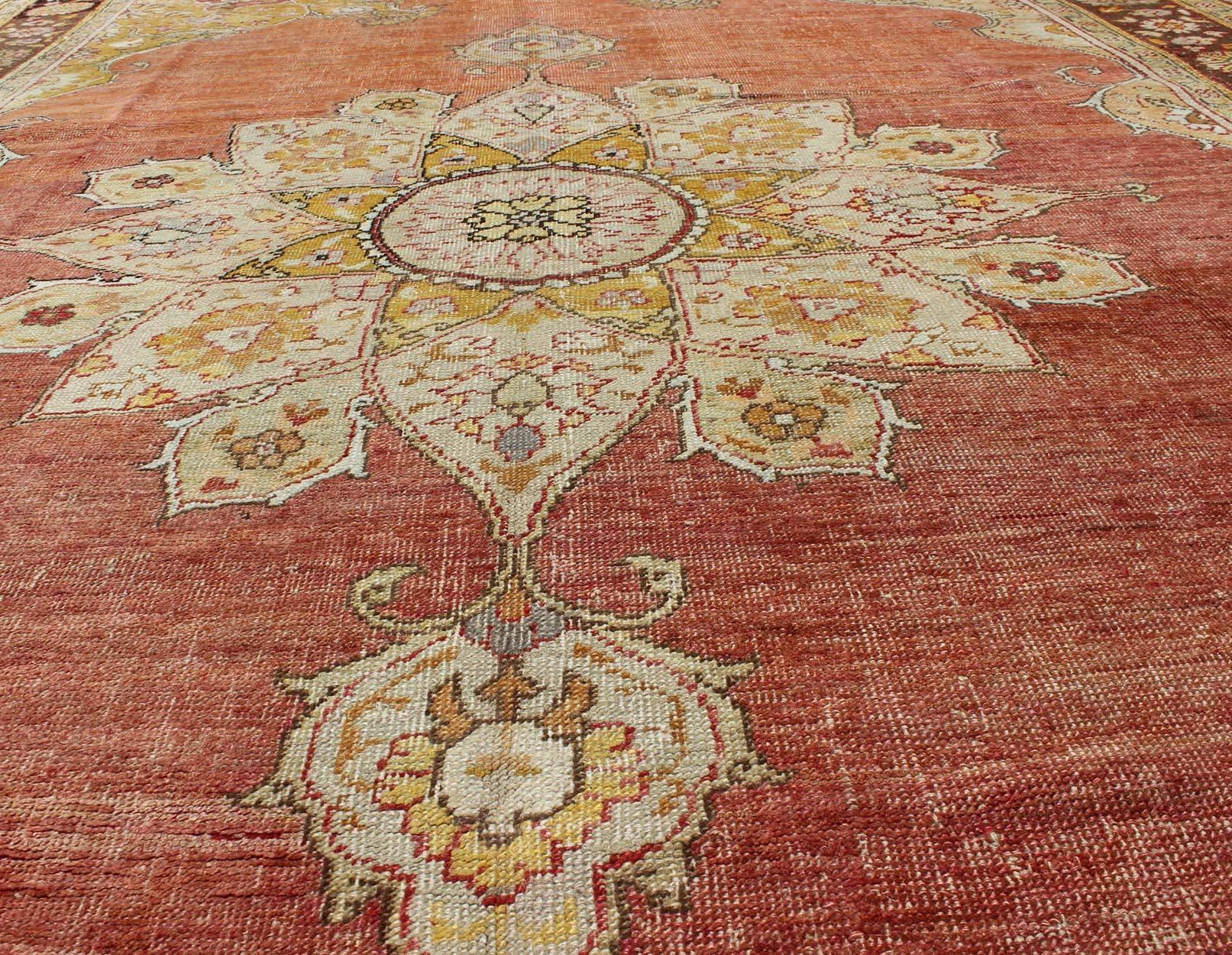 Wool Antique Oushak Medallion Rug in Rose, Pale Green, Light Blue, Gold and Brown  For Sale