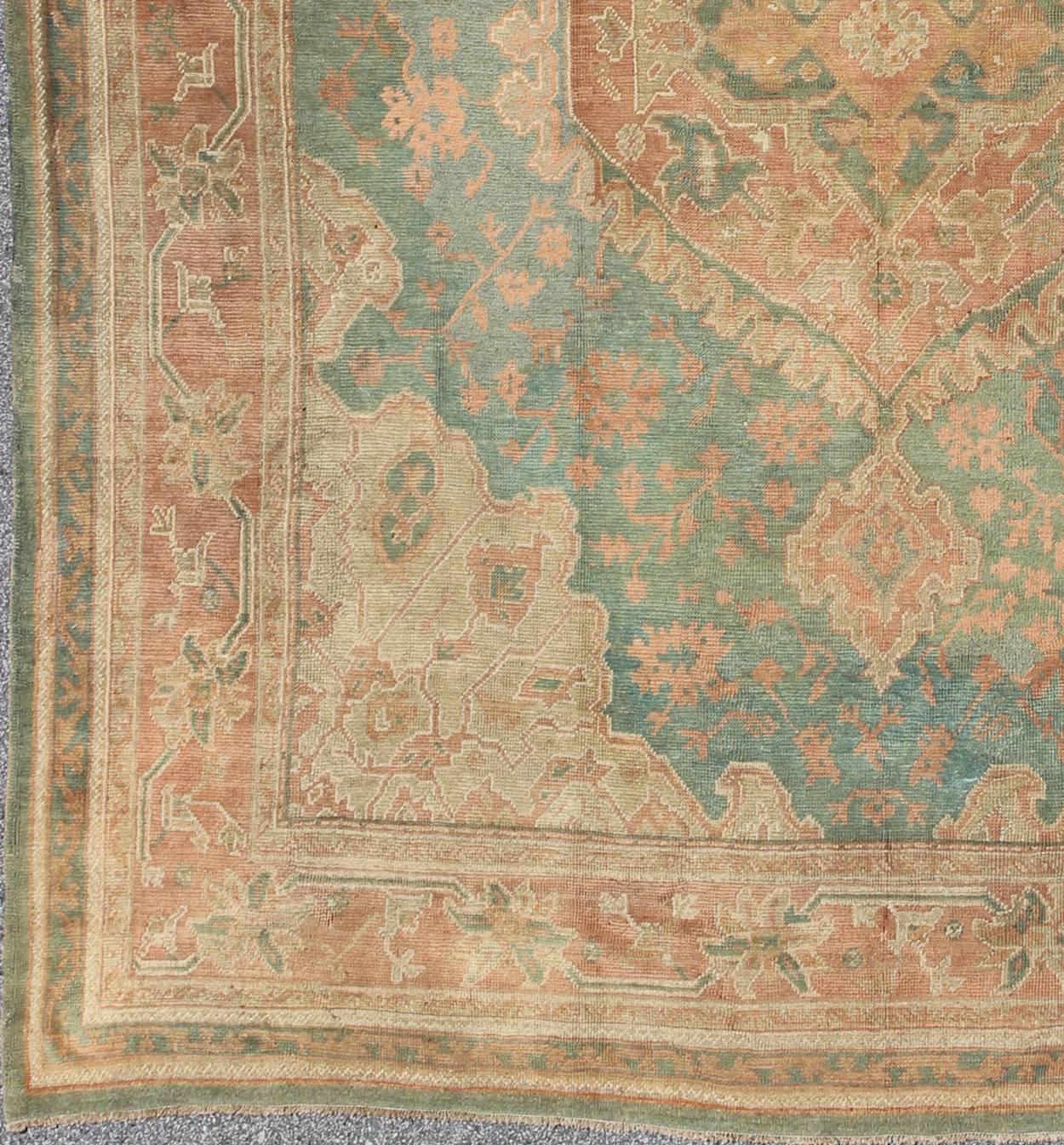 Measures: 12'2 x 13'6.

Inspired by 16th and 17th century antique medallion Oushak rugs, this inspiring square size antique Oushak was made in late 19th century. This antique Oushak displays a Gorgeous and unique background of teal green. Which