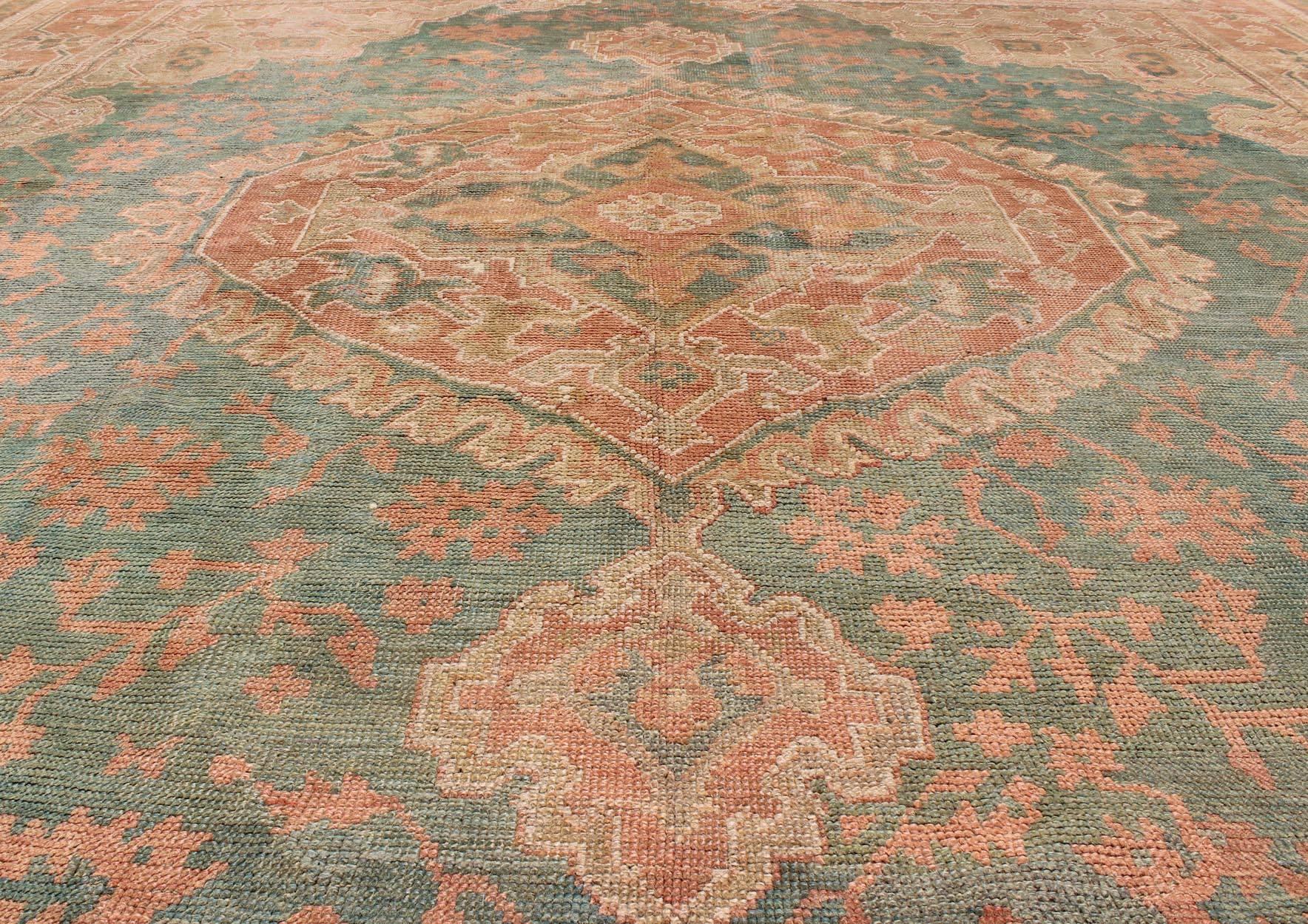 Wool Antique Turkish Medallion Oushak Rug in Teal Green, Rose and Buttery Colors