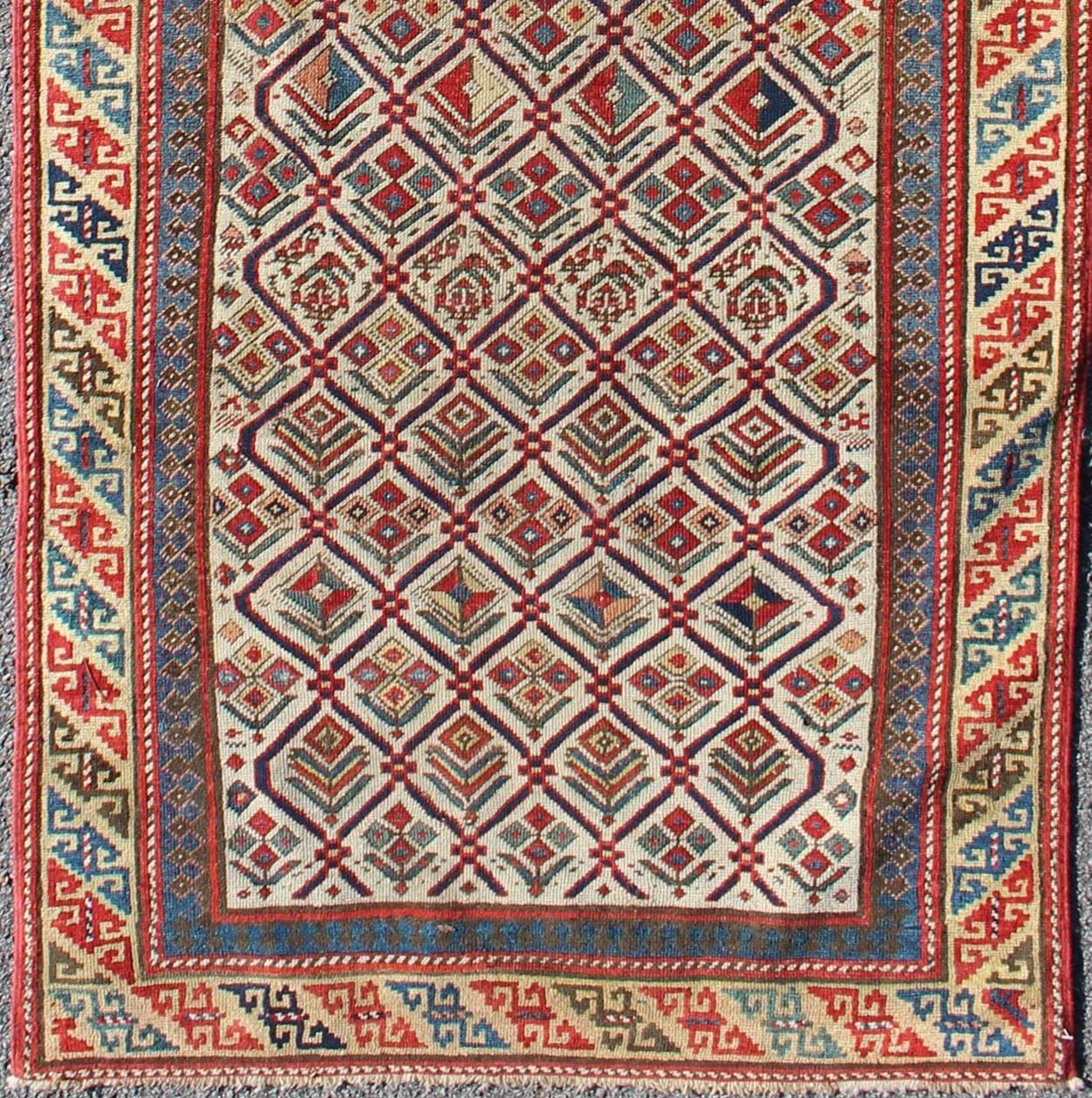 Antique Caucasian Shirvan Runner with Diamond Design in Ivory Background. Keivan Woven Arts / rug 11-91002, country of origin / type: Caucus / Caucasian, circa 1870.
Measures: 3'2 x 9'11
This beautiful Antique Shirvan runner was woven in the