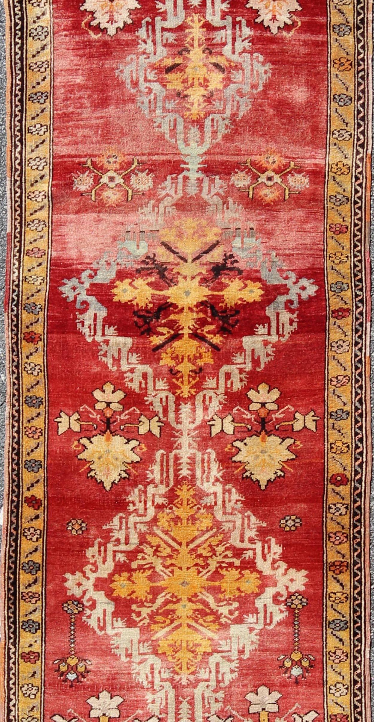 20th Century Antique Turkish Oushak Runner with Tribal Medallions in Red, Orange, and Yellow For Sale