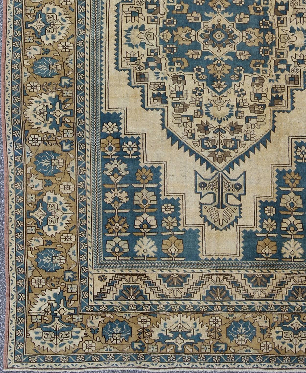 Turkish Vintage Rug With Geometric Design in Blue, Gold and Cream Colors. Keivan Woven Arts/ rug/EN-94362. Vintage Oushak, Blue Oushak  

Measures: 11'8 x 7'6

This vintage Turkish Oushak carpet was crafted around the 1940s and displays a beautiful