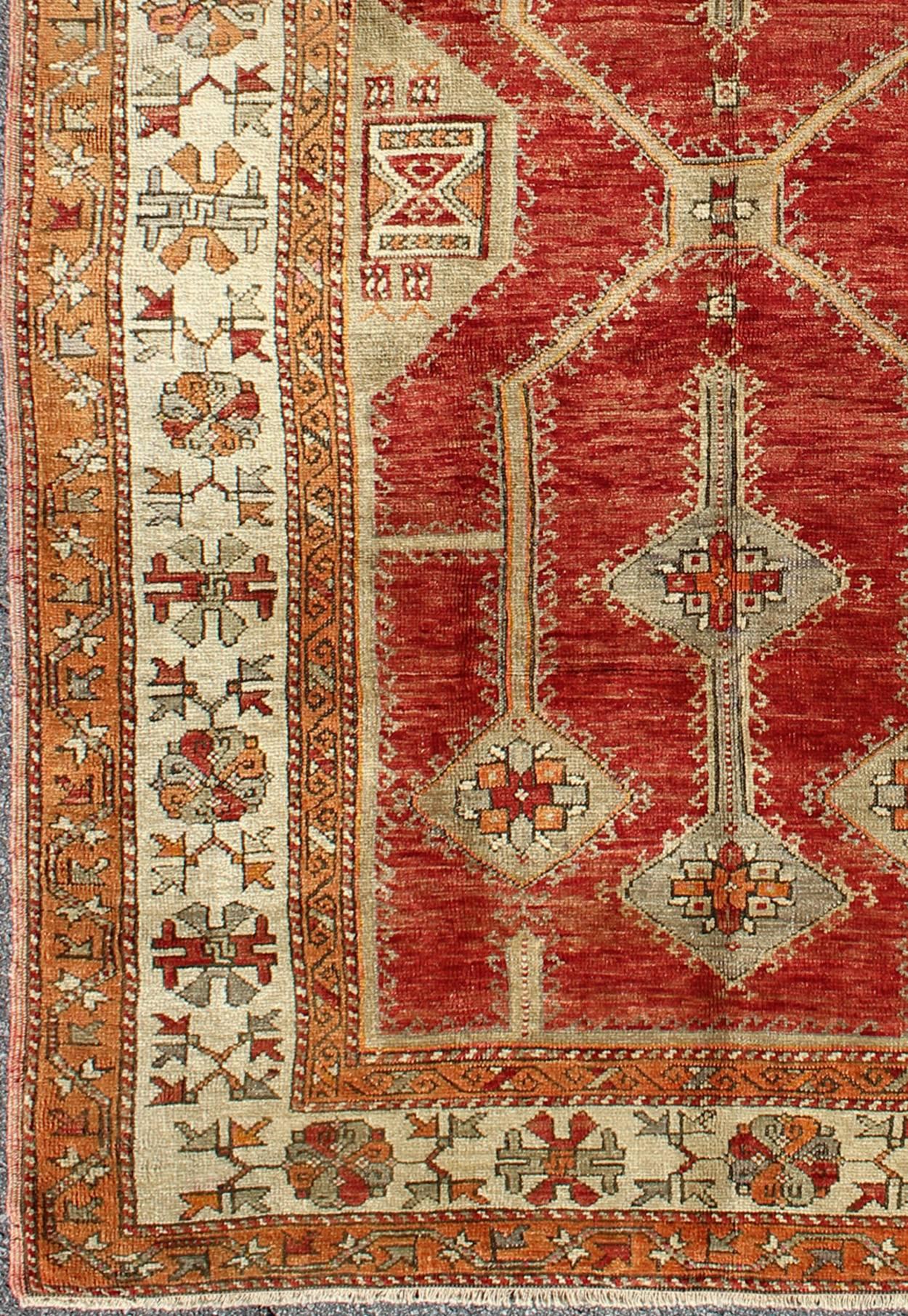 Antique Turkish Oushak Rug With Geometric Design in Red, Light Green & L. Orange.
Antique Turkish Oushak Rug with All-Over Geometric Design in Red, Light Green. rug/NA-75419
This unusual and uniquely designed  antique Turkish Oushak carpet was
