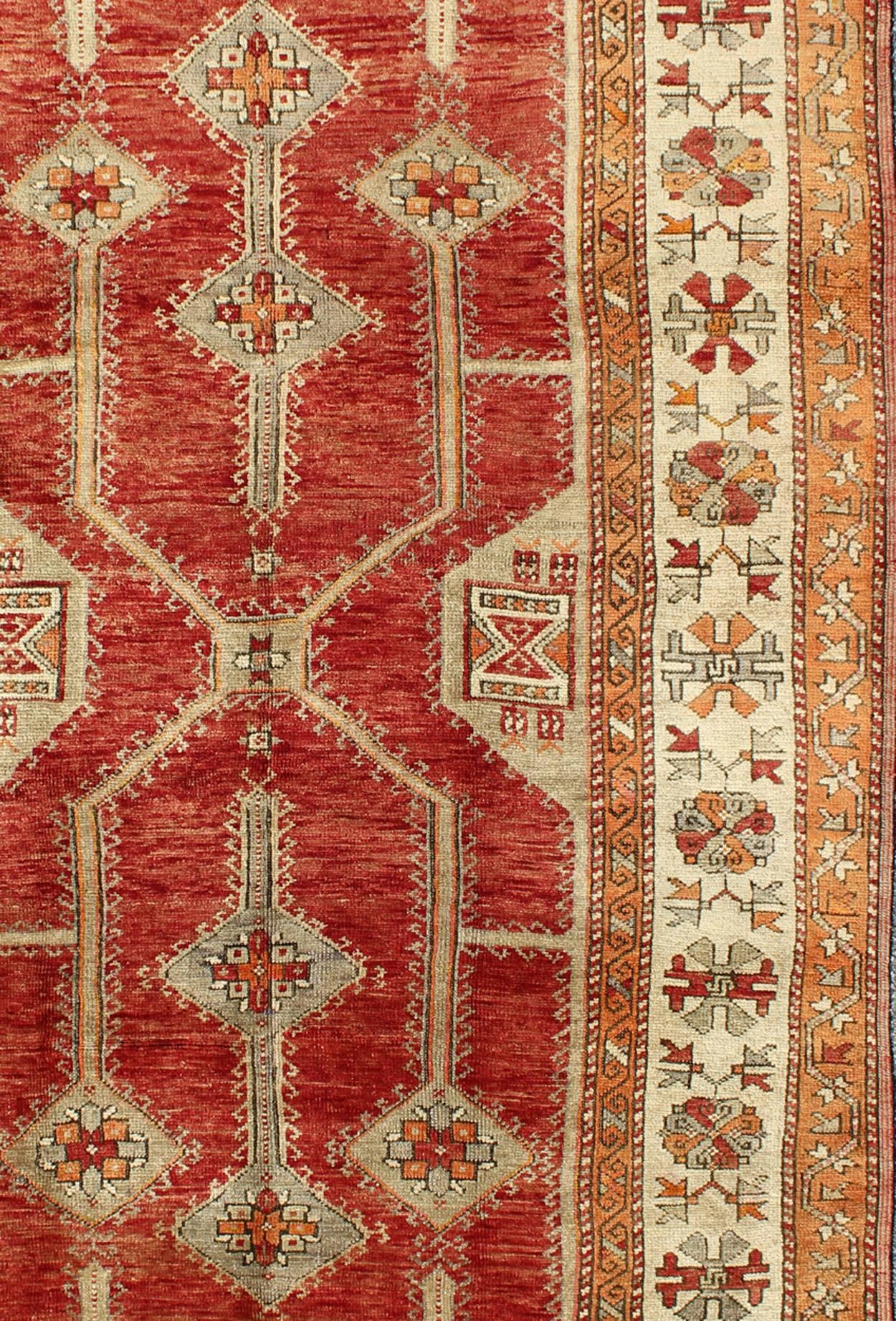 20th Century Antique Turkish Oushak Rug With Geometric Design in Red, Light Green & L. Orange For Sale