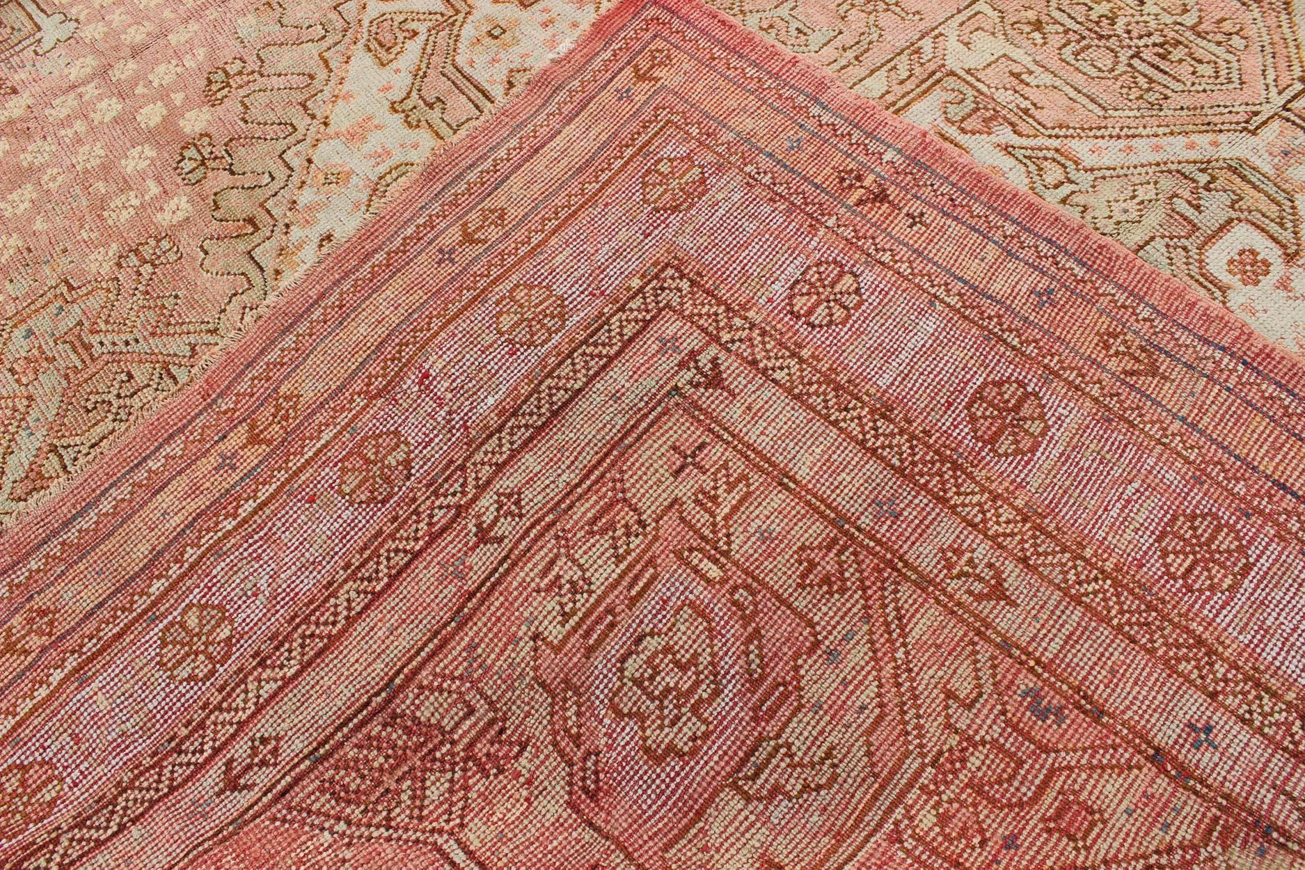 Antique Turkish Oushak Rug with Geometric Medallion in Salmon Background For Sale 2