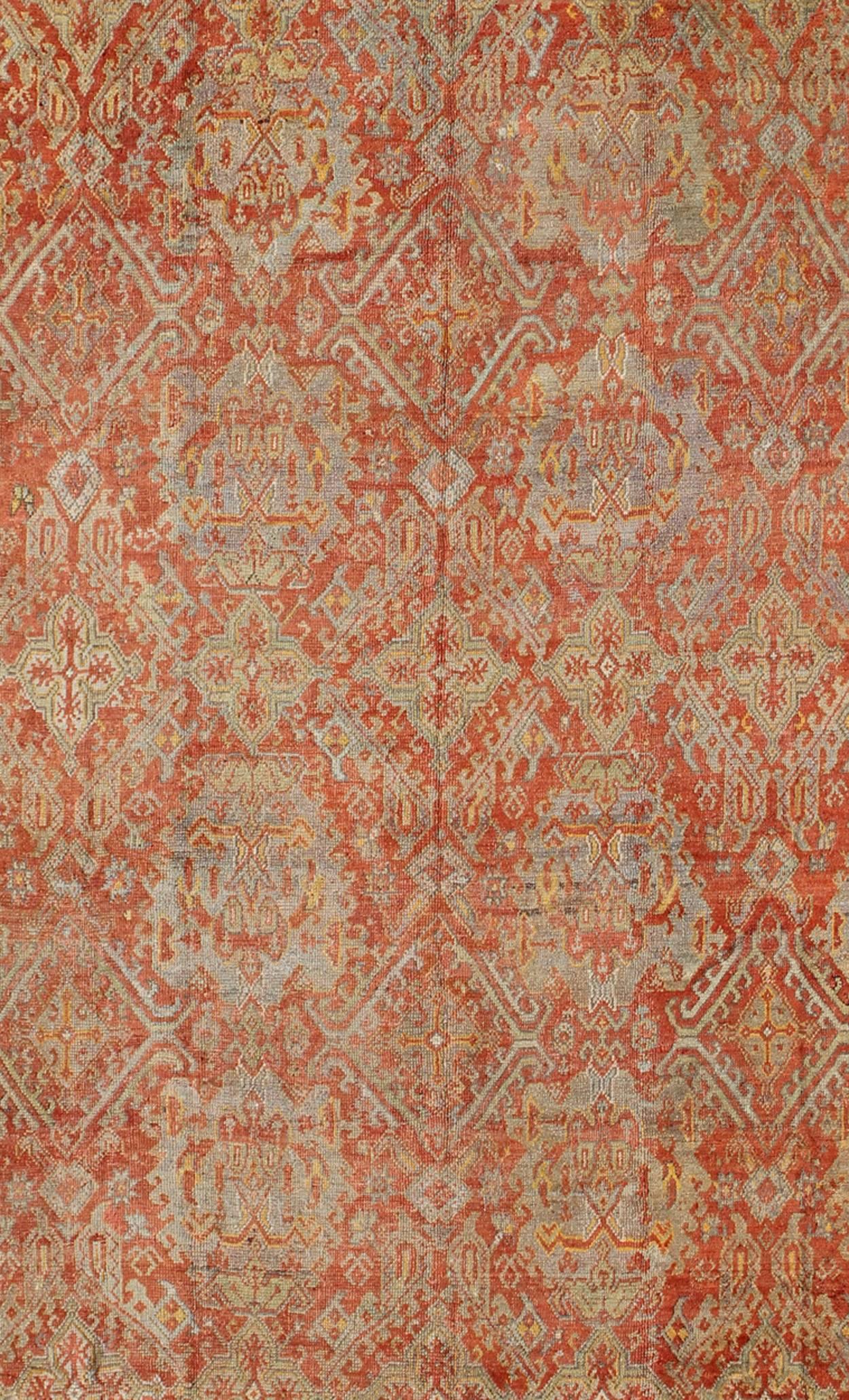 Hand-Knotted Antique Turkish Oushak Rug with Geometric Design in Soft Red, Light Blue, Yellow For Sale