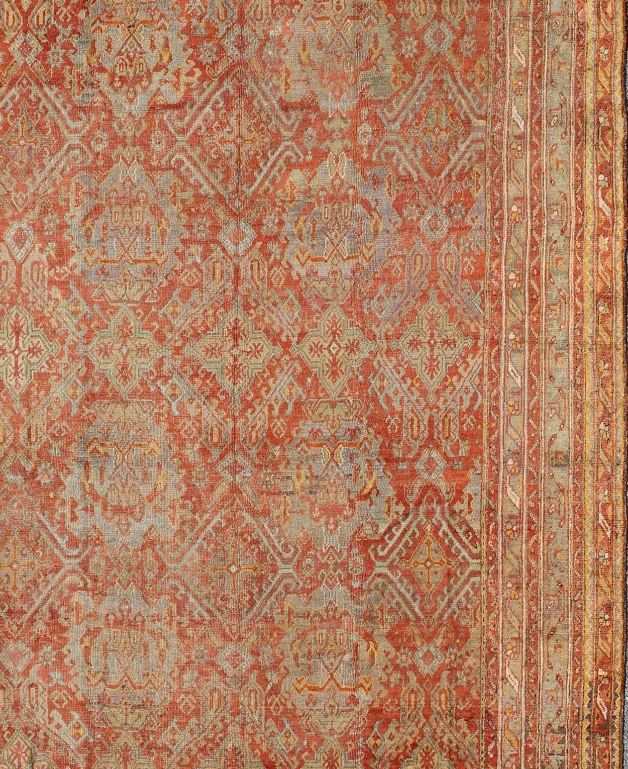 Antique Turkish Oushak Rug with Geometric Design in Soft Red, Light Blue, Yellow In Good Condition For Sale In Atlanta, GA