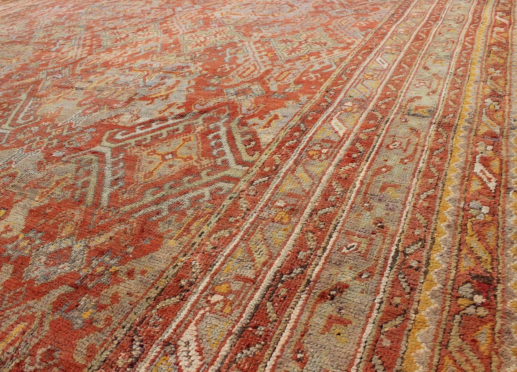 19th Century Antique Turkish Oushak Rug with Geometric Design in Soft Red, Light Blue, Yellow For Sale