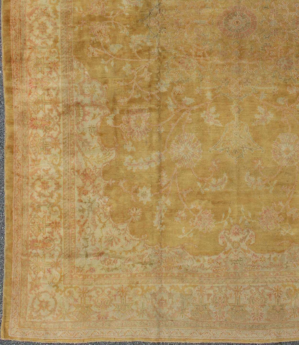 Stunning antique fine Burlu Oushak rug in gold, salmon, pink, soft green and neutral tones. Keivan Woven Arts / rug G-0705, country of origin / type: Turkey / Oushak, circa Late 19th-century
Measures: 11'10 x 14'5.
This finely woven antique Burlu