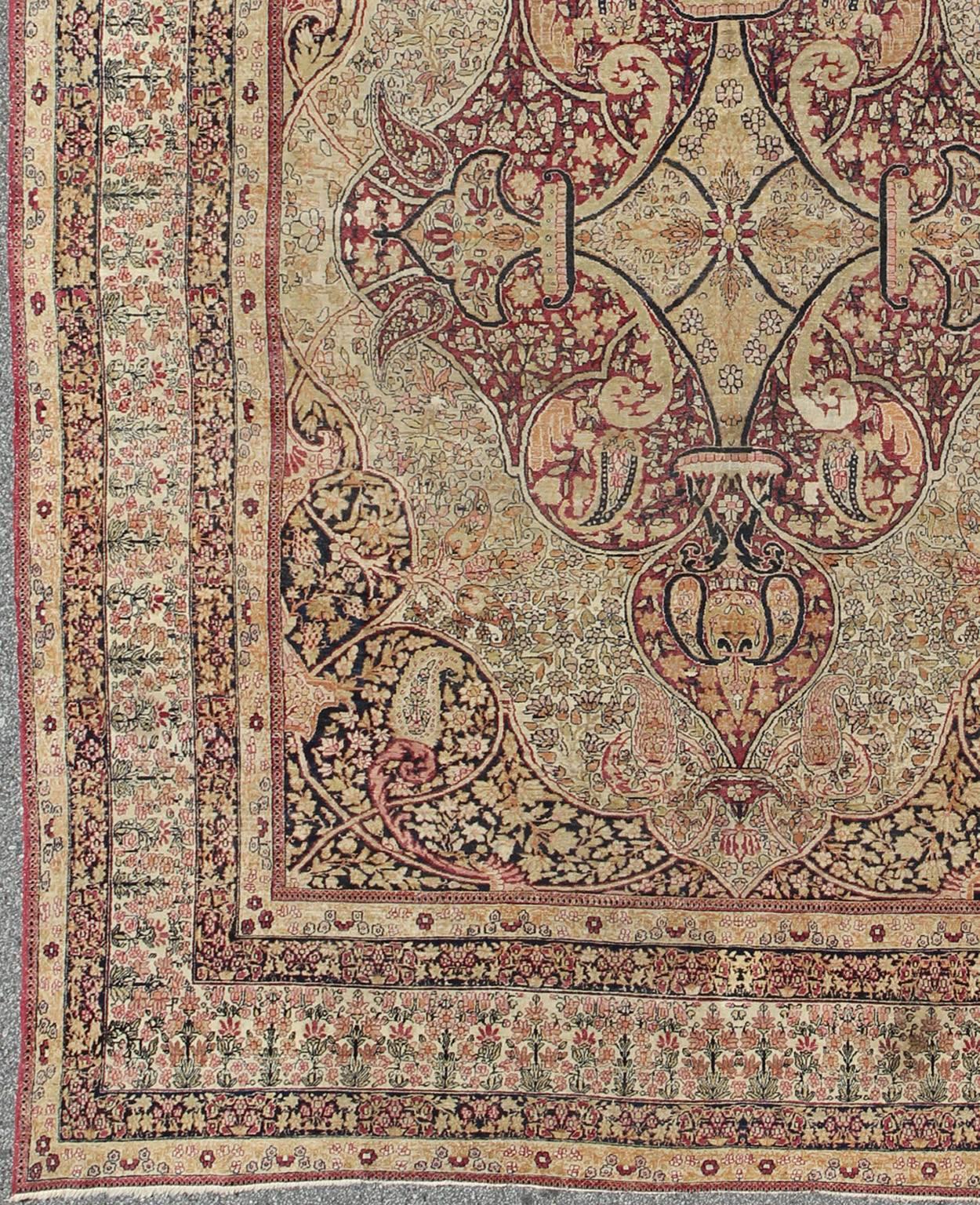 Antique 19th Century Persian Lavar Kerman Rug With Floral Medallion With Pink. Keivan Woven Arts/  rug 11-20916, country of origin / type: Persia/Iran / Lavar Kerman/Ravar Kerman 
Measures: 10'4 x 14'6.
This 19th century Persian Lavar Kerman/Ravar