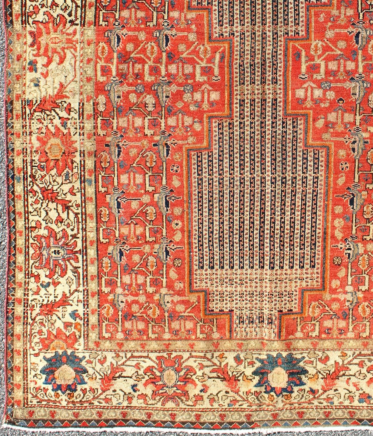 Mishan Malayer pieces are both rare and among the finest of Seneh and Malayer rugs. Made in the late 19th Century, this rug carries an unusual design of double-bodied medallions, which are composed of alternating pinstriped patterns. Designs of lush