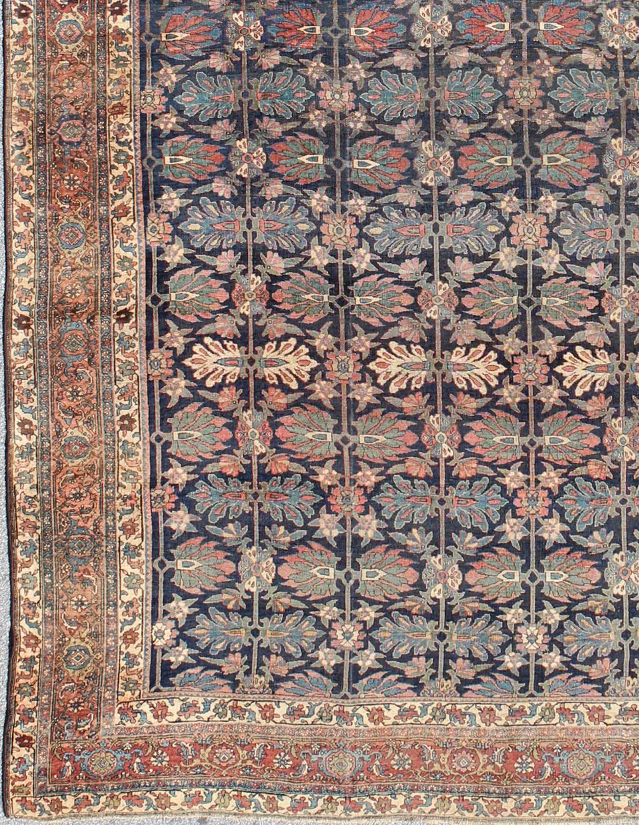 Large antique Persian Bidjar rug in blue background and alternating floral pattern, rug / TRA-8051. Large Antique Bidjar
Distinguished primarily by their dense, durable weaves, Bidjar carpets are fantastic representations of the skill, artistry and