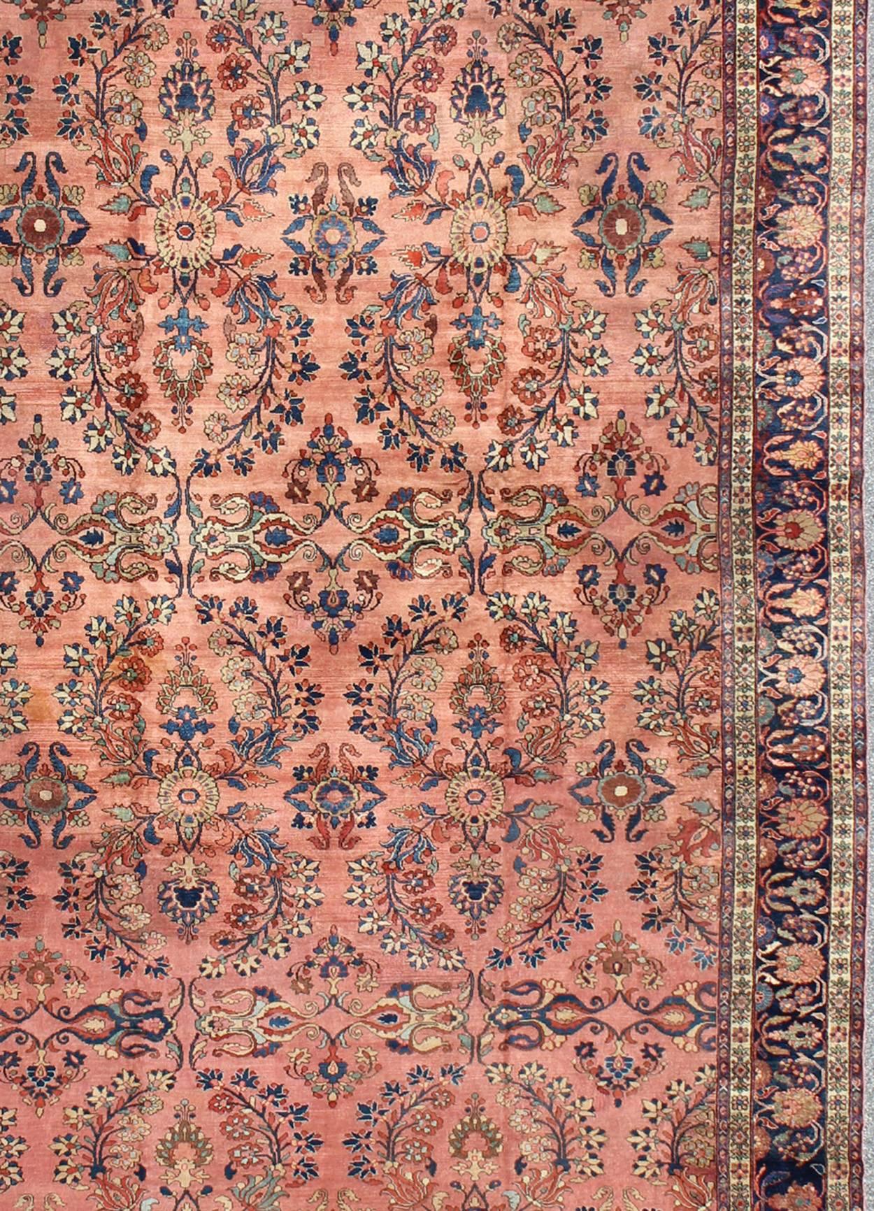 Alfombra Persa Antigua Lilihan de 11'1 x 17' en colores salmón, azul, verde y óxido Anudado a mano en venta