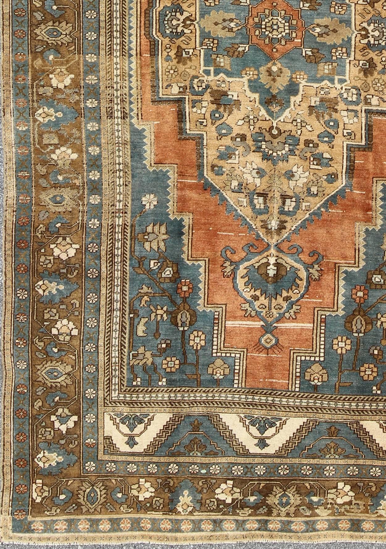 Antique Turkish Colorful Oushak Gallery Rug In Blue Brown & Terra-cotta. Rug/EN-AGA-004, Colorful Oushak, Antique Oushak.
A singularly masterful work of art, this richly patterned antique Turkish Oushak carpet balances a perfect blend of geometric