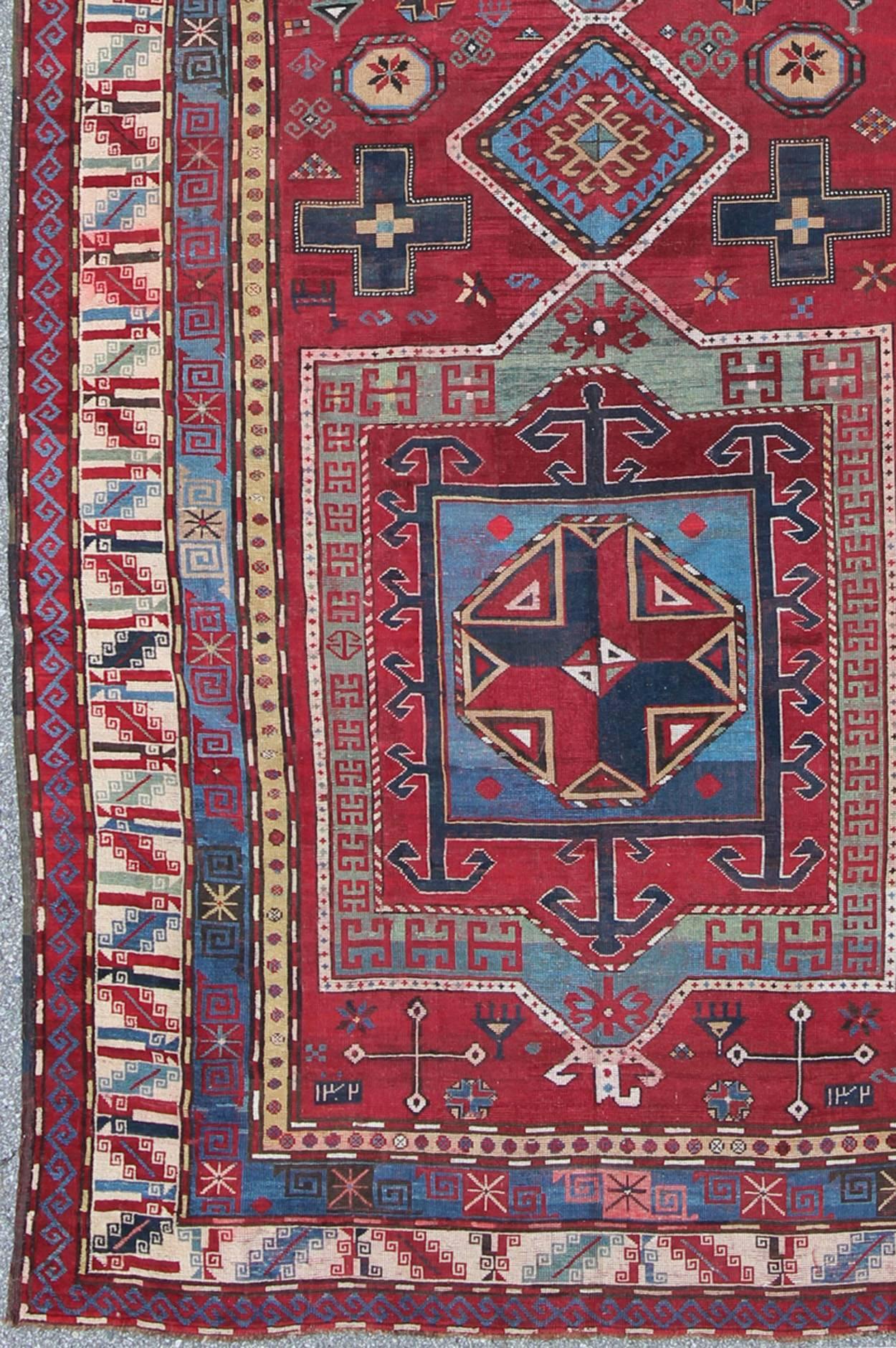 Antique Caucasus Kazak Carpet with Dual Geometric Medallions.
This stunning 19th century Kazak rug from the Caucasus region displays magnificent, dual, geometric medallions and an all-over geometric design. A dynamic palette of red, blue, ivory,