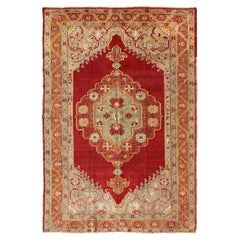 Early 20th Century Antique Turkish Oushak Rug With Stretched Floral Medallion