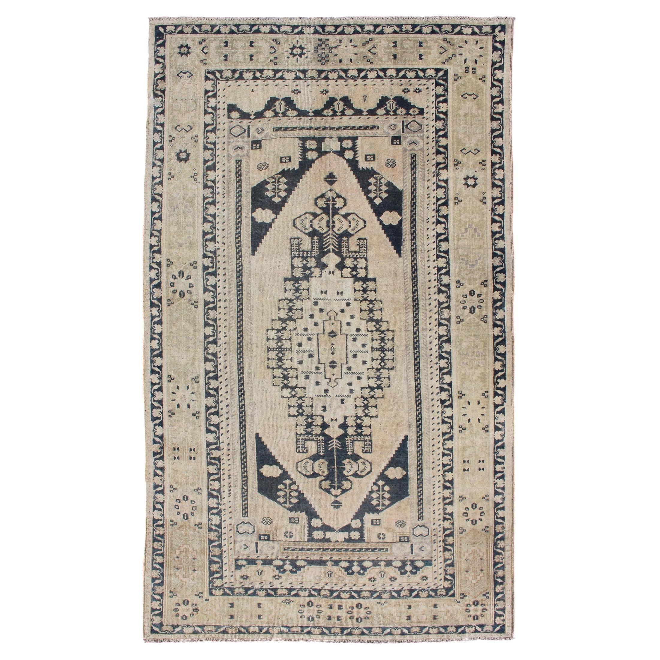 Vintage Turkish Oushak Rug with Ivory Field and Deep Blue Medallion Design