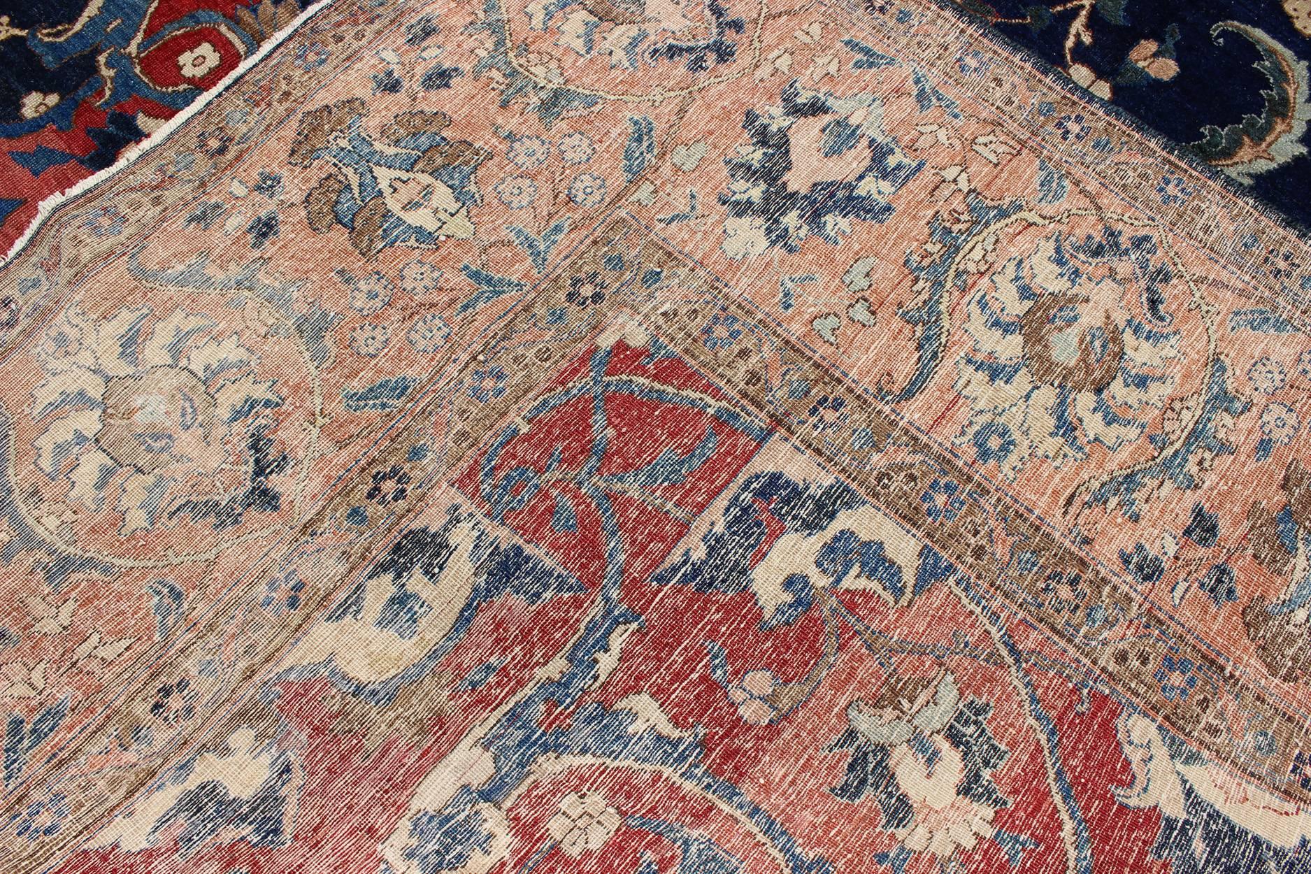 Antique Large Persian Tabriz Rug with Large Flowers On A Navy Background In Good Condition For Sale In Atlanta, GA