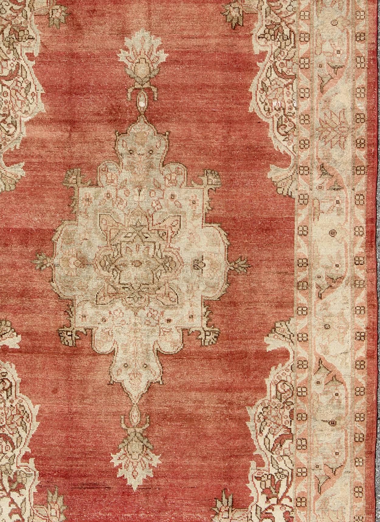 Mid-20th Century Antique Turkish Oushak Medallion Rug in Soft Red Background, Taupe & Pale Green For Sale