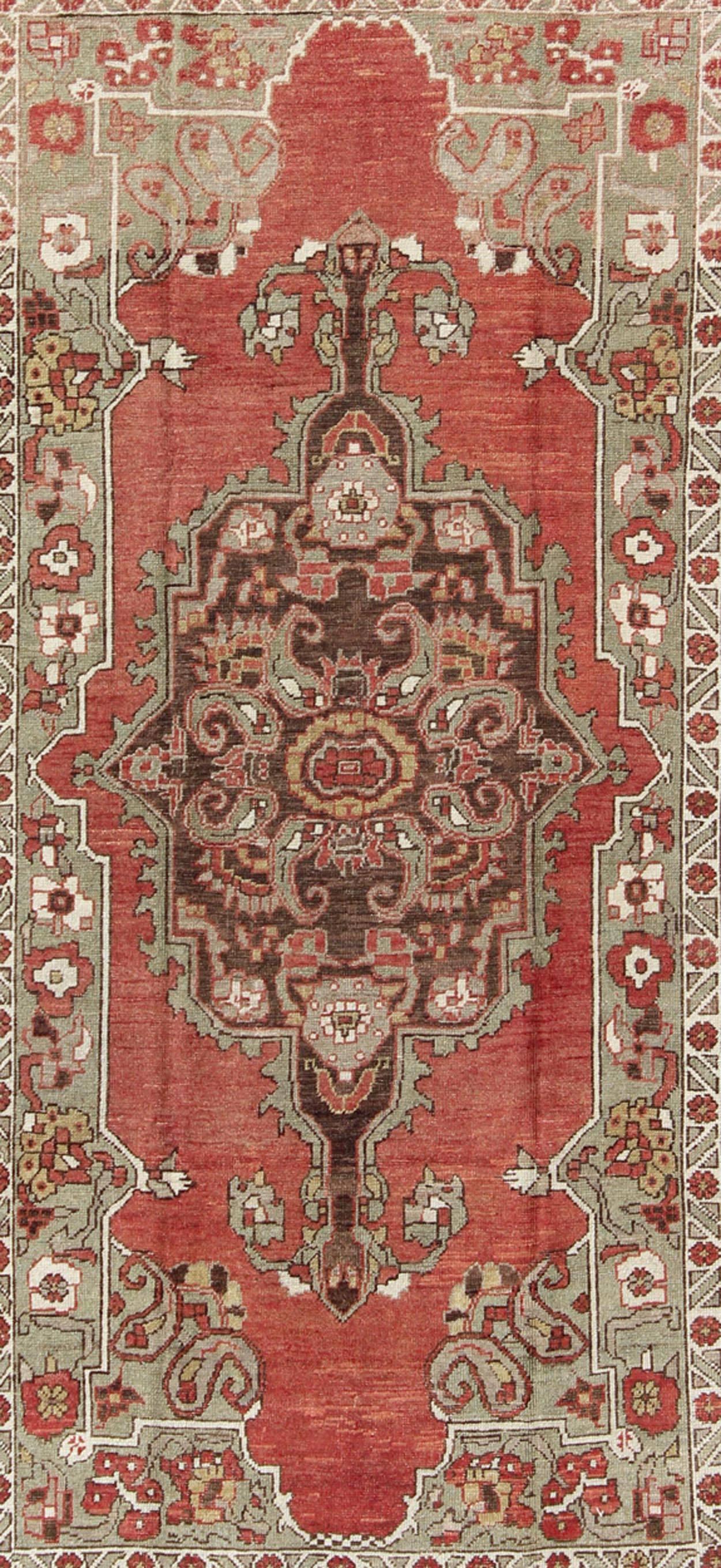 Antique Turkish Oushak Carpet with Medallion in Soft Red, Green and Brown  In Good Condition For Sale In Atlanta, GA
