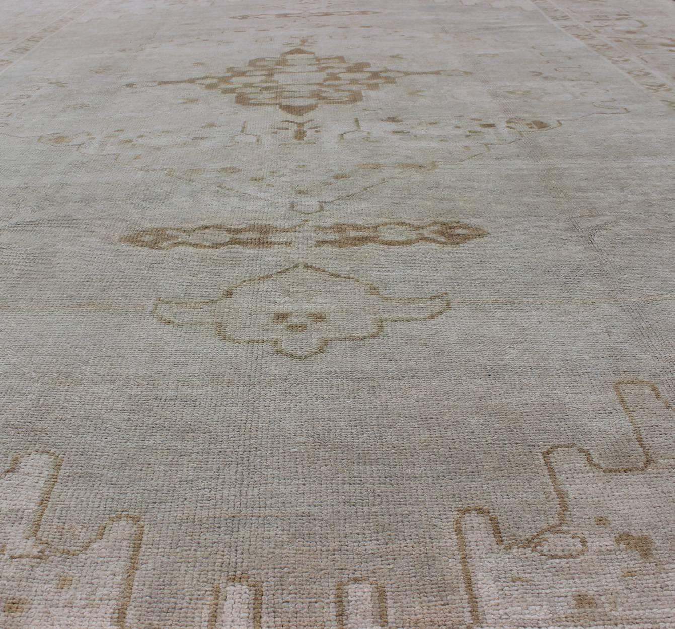 Wool Vintage Turkish Oushak Rug with Large Central Medallion in Neutral Tones For Sale