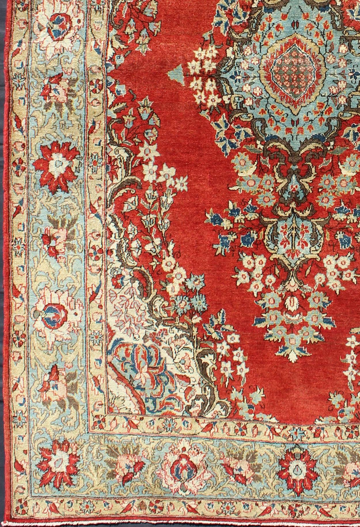 This spectacular Persian Qum bears a magnificent splendor indicative of oyal tastes, which sought perfection in balance and palette. The circular, script-style medallion displays various floral motifs and is complemented by two stretched palmettes