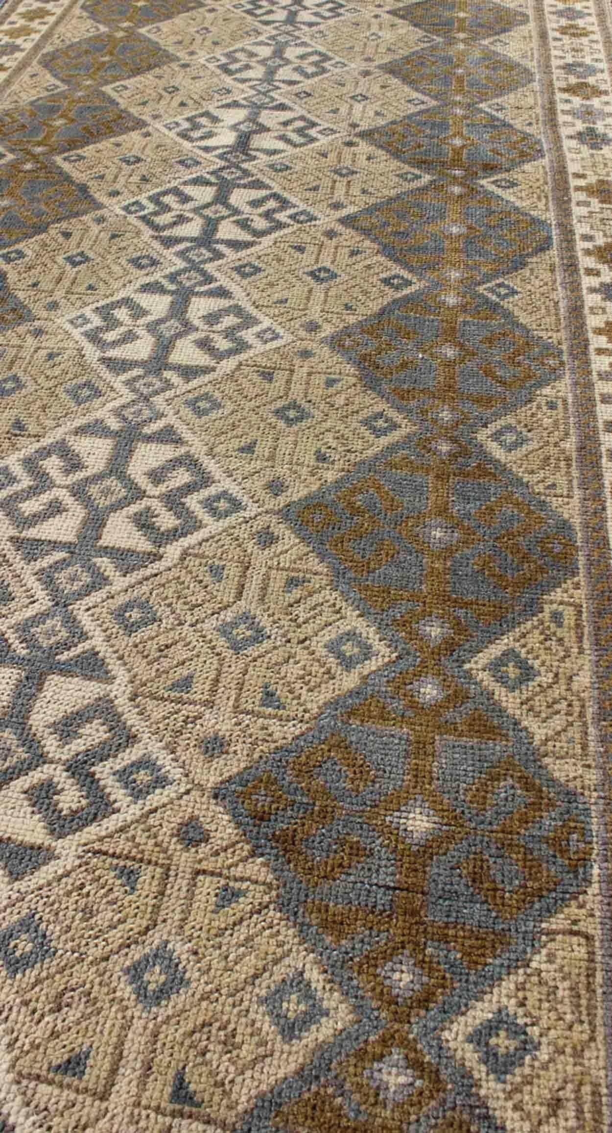 20th Century Antique Turkish Oushak Runner with Symmetrical Geometric Design For Sale