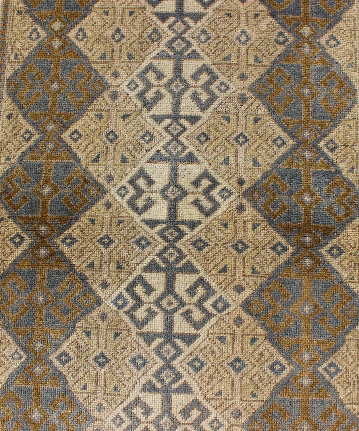 Wool Antique Turkish Oushak Runner with Symmetrical Geometric Design For Sale