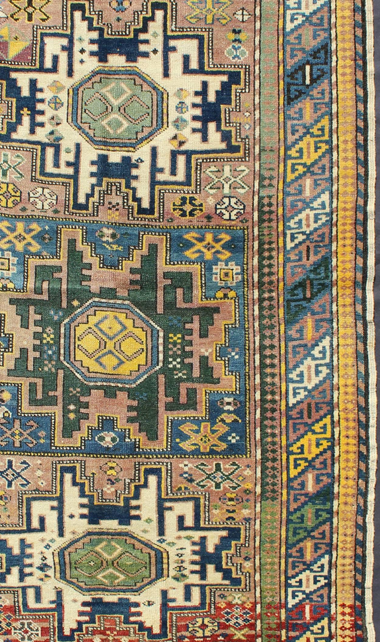 Hand-Knotted Antique Colorful Kuba Caucasian Rug with Star Medallions in Green, Blue, Yellow For Sale