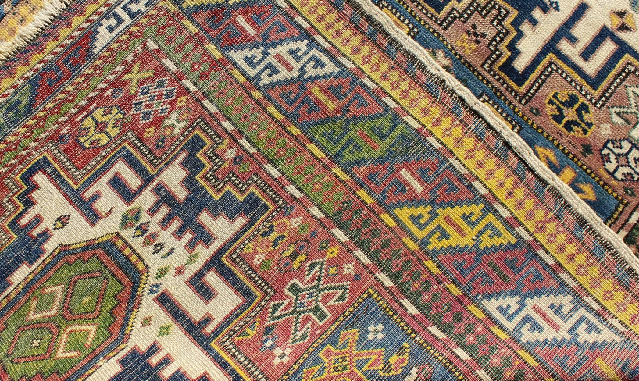 19th Century Antique Colorful Kuba Caucasian Rug with Star Medallions in Green, Blue, Yellow For Sale