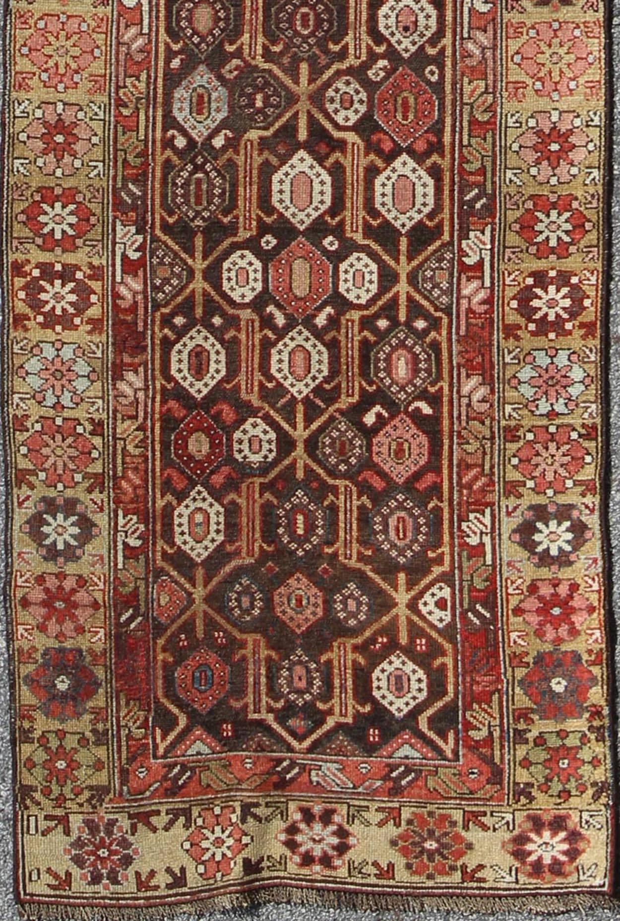 Antique hand knotted Kurdish Runner with all-over Geometric design. Keivan Woven Arts / rug/13-1103, country of origin / type: Iran / Kurdish, circa 1900

This Kurdish tribal runner was woven by Kurdish weavers in western Persia. The emphasis with
