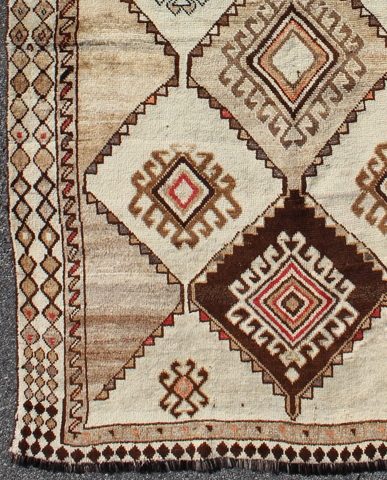 Vintage Persian Gabbeh with Diamond and Geometric design in Earth tones. rug J10-1021, country of origin / type: Iran / Gabbeh, circa 1940

This high-pile excellent condition Persian Gabbeh from Southern Iran consists of large scale repeating,