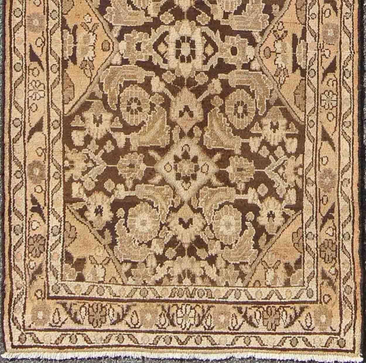This magnificent Hamedan features beautiful earth colors and tones. The border consists of intricate flowers connected by vines. The main part of the rug has a wonderful pattern consisting of earth tones and a light green-blue color. This unique