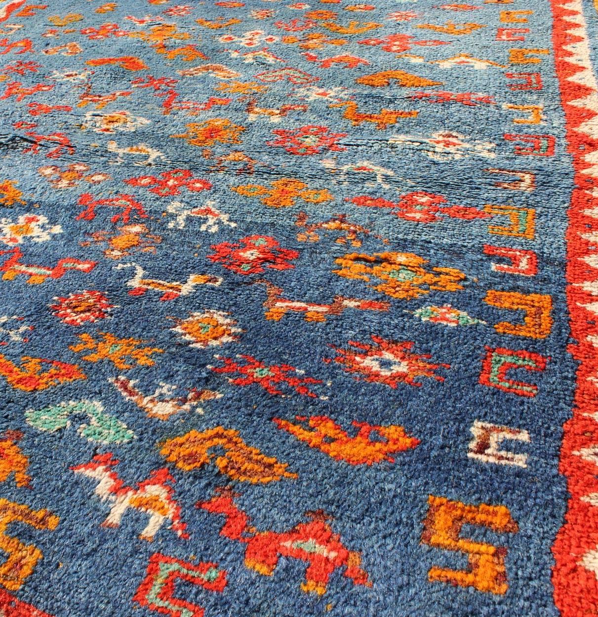 Hand-Knotted Vintage Moroccan Rug with Beautiful Blue Background