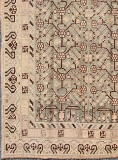 Antique Khotan Rug Featuring Repeating Lattice Motif in Soft Gray, Warm Beige