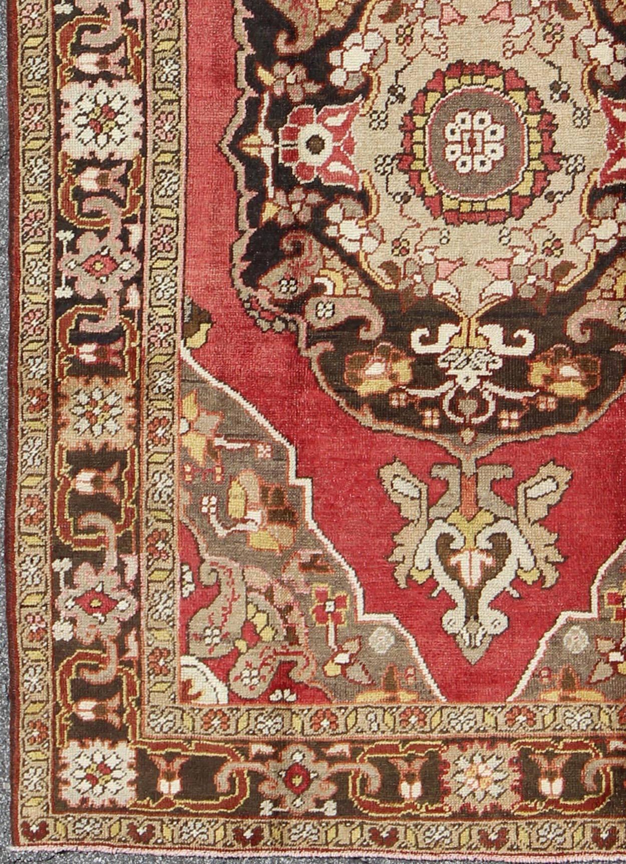 Turkish Antique oushak with scroll-flower pattern in brown, red, light green, gray taupe and yellow. En-112094, 1930's Antique Turkish Oushak Rug. 

This wonderful Turkish Oushak features chocolate brown border and medallion, red background with a