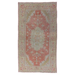 Antique Turkish Oushak Rug with Floral Motifs and Coral Background