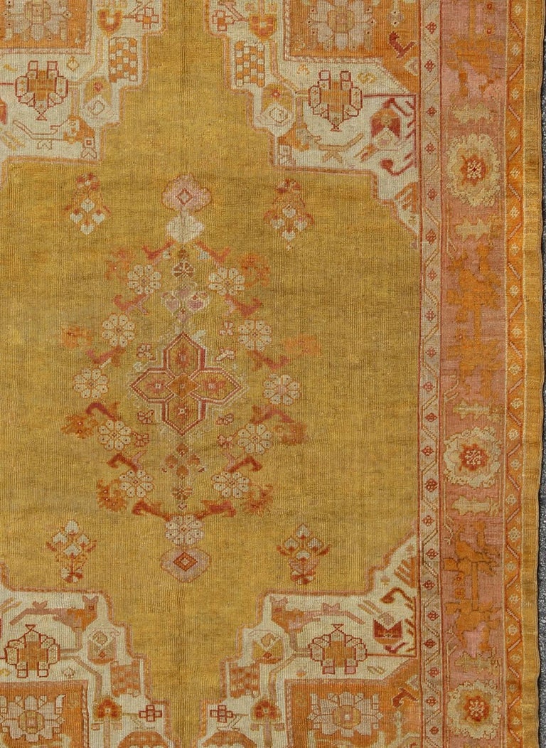 Antique Oushak Rug in Yellow Green Background, Pink Border, Red and