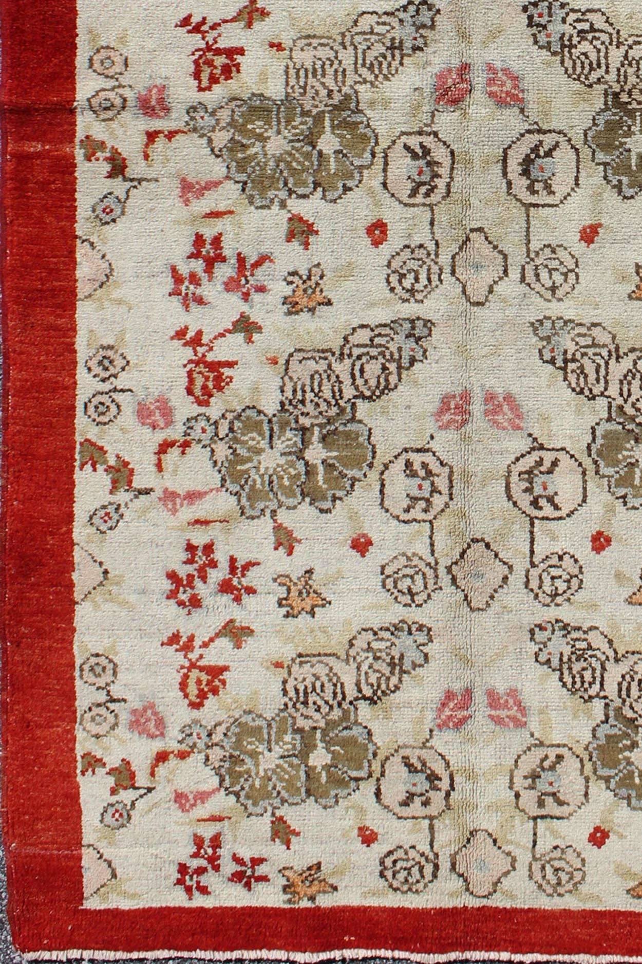 Vintage Turkish Oushak Rug with all over Floral Design in Ivory, Green and Red. Keivan Woven Arts /  Rug / ST-329 Mid-20th Century Vintage Oushak.  
Measures: 3' x 6'2
This Oushak contains tones of red, taupe, beige and green, which are highlighted