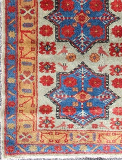 Türkischer Teppich mit Sternmuster in Hellgrün, Orange, Rot und Blau