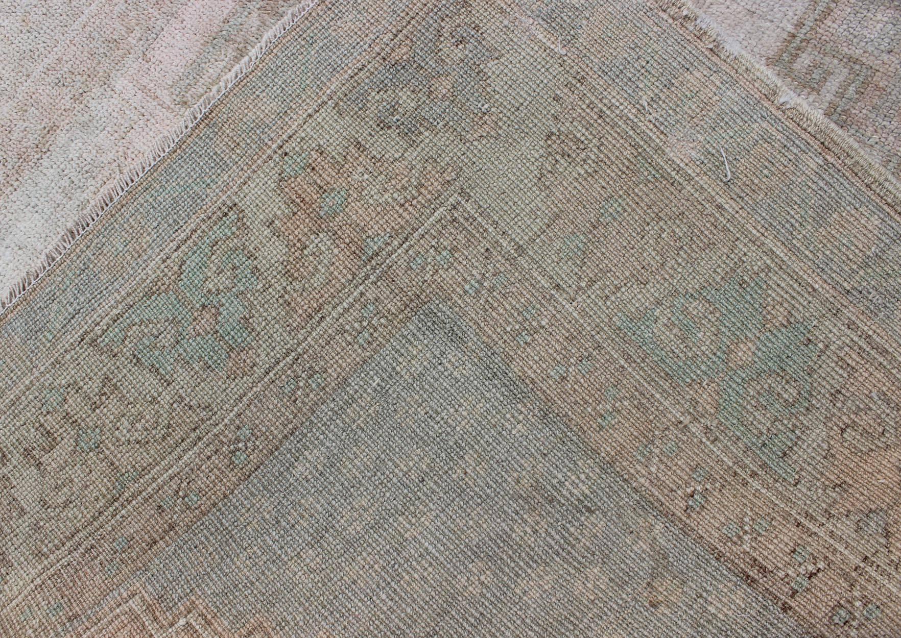 Wool Mid-Century Muted Vintage Turkish Oushak with Central Medallion Design For Sale